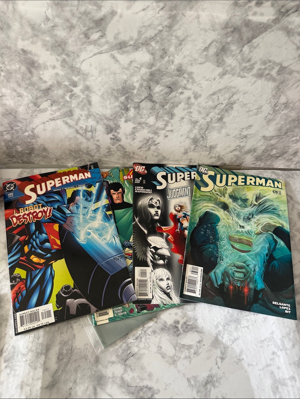 DC Superman Comic Set with Blue, Green and Red Covers